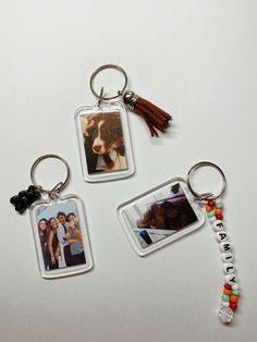 three different key chains with pictures on them