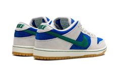 The Nike SB Dunk Low “Hyper Royal/Malachite” is a colorway of the skateboarding shoe with a can’t-miss color scheme.  Made for skateboarding or casual wear, the SB Dunk Low “Hyper Royal/Malachite” comes in eye-catching colors, with Hyper Royal suede appearing on the base and Phantom-colored suede appearing on the overlays.  A Malachite suede Swoosh logo is seen on the sides.  More Malachite accenting appears on the “Nike” embroidery on the heel and on the branding on the tongue tag.  A gum rubbe Nike Embroidery, Low Dunks, Top Basketball Shoes, Nike Sb Dunk Low, Black Converse, Sb Dunk Low, Nike Sb Dunks Low, Nike Sb Dunk, Nike Brand