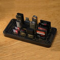 an electronic device sitting on top of a wooden table