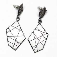 "A modern play on sterling silver dangle earrings. These earrings are hand made from recycled sterling silver sheet. The design is sawed by hand and polished to a matte finish. The silver has been oxidized to add depth and beauty. Solid 925 Sterling Silver About 2\" L x .75\" W Post style with deluxe Luxlock Backs-Safe, Secure, Comfortable Artisan made in Texas The earrings will arrive thoughtfully packaged in a signature jewelry box. Click here to see all of my earrings: https://www.etsy.com/sh Contemporary Sterling Silver Dangle Earrings, Anniversary Earrings With Oxidized Finish, Dangle Shape, Modern Geometric Sterling Silver Earrings, Artisan Nickel-free Rectangular Earrings, Sterling Silver Modernist Earrings, Sterling Silver Dangle Earrings, Signature Jewelry, Silver Earrings Dangle, Recycled Sterling Silver