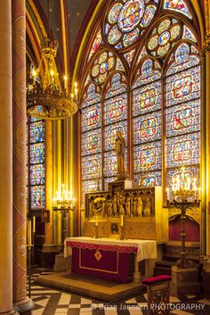 the interior of a church with stained glass windows