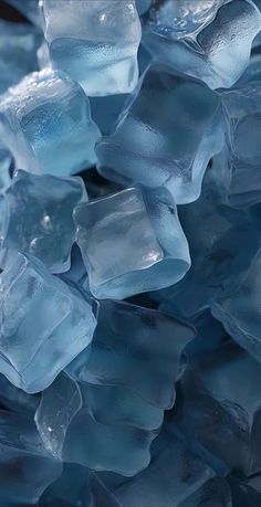 blue ice cubes are piled together on top of each other in this close up photo