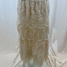 New, Never Worn , But Without Tags, Bryan Emerson Ivory Cotton Lace With Fringe Multi Layer Maxi Skirt. Features An Elastic Waistband, Belt Loops, Fully Lined. Size Reads Os But Probably Fits A S Or Xs Measurements Taken Lying Flat And Are Approximate And Unstretched Length 35 Waist Unstretched - 12 Hips 18 Beige Lace Tiered Skirt, Bohemian Lace Bottoms In Cream, Bohemian Cream Lace Bottoms, Cream Lace Bohemian Bottoms, Cream Tiered Skirt With Lace Trim, White Bohemian Bottoms With Fringe, Bohemian White Bottoms With Fringe, Bohemian Cream Lined Skirt Bottoms, White Fitted Fringe Skirt