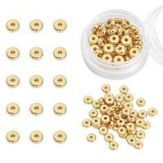 gold plated metal spacer beads and screws in a clear plastic container on a white background