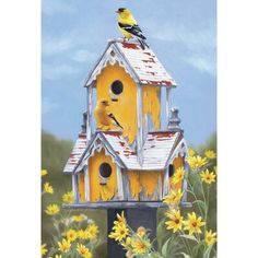 a yellow birdhouse with two birds on it's roof and flowers in the foreground