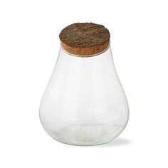 a glass vase with a cork top on a white background