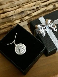 "❤ Genuine Sterling Silver small Cherub Angel Memorial Necklace Or Bracelet❤ .925 Sterling Silver 1/2 inch Cherub Angel charm Sterling Silver Chain (you select style & length) or Adjustable Bangle Bracelet Adjustable bangle- 63mm- fits 7 to 8.5 inch wrists. Stamped \"925\" for authenticity. Comes beautifully packaged - ready to give as a gift or keep for yourself! SHOP Forever Memory Designs: http://www.etsy.com/shop/ForeverMemoryDesigns" Silver Necklace For Valentine's Day With Gift Box, Silver Jewelry With Gift Box For Birthday, Silver Necklaces With Gift Box For Valentine's Day, Silver Jewelry Gift Wrapped For Mother's Day, Silver Jewelry Gift For Mother's Day, Sterling Silver Jewelry For Birthday Gift With Gift Box, Sterling Silver Jewelry For Birthday Gift With Box, Silver Necklace With Gift Box For Gift, Valentine's Day Silver Jewelry Gift Wrapped