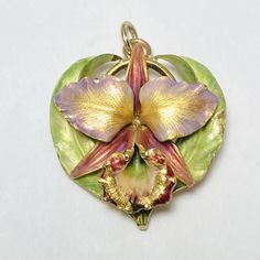 Vintage 14K Yellow Gold  Enamel Orchid Flower Pendant Pendant without bail measures approx. 28.5 x 27.2 x 11.4 mm Bail will fit up to 2.5 mm chain Stamped 14K with an unidentified pictorial maker mark Total weight approx. 7.76 g Very good preowned condition, please see photos for detail Art Nouveau Jewelry Necklace, Nouveau Jewelry, Antique Jewelry Necklace, Art Nouveau Jewelry, Orchid Flower, Gold Enamel, Gorgeous Jewelry, Flower Pendant, Antique Art