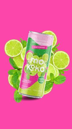 a can of soda with lime slices and mints on it, against a pink background