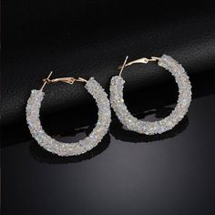 A fun update to the timeless bold hoop earrings. Completely encrusted in a sparkly crystal tube, available in three color options: black, iridescent black (with a blue-green shine) and opalescent white. Material: Alloy/Crystals Size: 4.5m (1.75 inches) Comes in gift boxed. Trendy Sparkling Hoop Earrings For Party, Party Hoop Crystal Earrings With Sparkling Stones, Sparkling Hoop Crystal Earrings, Sparkling Crystal Hoop Earrings For Party, Silver Small Hoop Crystal Earrings For Party, Sparkling Crystal Hoop Earrings, Small Crystal Hoop Earrings For Party, Trendy Sparkling Stones Hoop Earrings For Party, Party Small Hoop Crystal Earrings