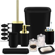 black and gold bathroom accessories including soap dispenser, toothbrush holder, toiletries