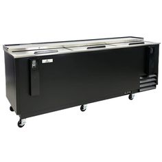 an image of a black cooler with wheels on the bottom and two drawers in front