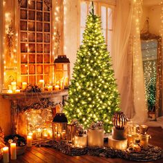 a lit christmas tree surrounded by candles