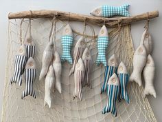 several fish are hanging on the wall in a hammock with rope and burlocks