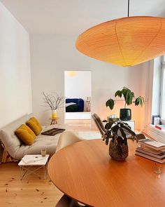 a living room filled with furniture and a wooden table