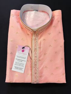 "Designer Baby color Raw Silk Kurta Pajama Set. - Ready to Wear Pink color/ Baby Pink Color Men Kurta Pajama Set in Raw Silk material. - Kurta has Lining and Hand embroidery Work on the neckline and Collar. - Real Mirror Work on the Neckline and Collar of the Kurta. - Kurta comes with Free Size Churidar Bottom. Disclaimer -For sizing please refer to the Size Chart given in the listing with the pictures. - Please do NOT go by the size of the Kurta that you already have from another maker. All mak Fitted Pink Kurta For Ceremonial Occasions, Fitted Kurta With Traditional Patterns For Puja, Pink Kurta For Ceremonial Festivals, Pink Kurta For Ceremonial Festive Occasions, Fitted Self-design Bandhgala For Puja, Fitted Bandhgala With Self Design For Puja, Fitted Bandhgala With Traditional Patterns, Pink Fitted Ceremonial Traditional Wear, Ceremonial Fitted Pink Traditional Wear