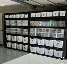 the shelves are filled with plastic containers and bins