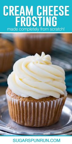 a cupcake with cream cheese frosting on top