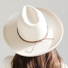 A hat band that is simple but stylish, the double strand rope band is the perfect minimal touch to take your hat style to the next level. Material - Waxed cotton Simply slide the band over the top of the crown of your hat to the point the crown touches the brim and then pull tails of band to tighten. Top Hats For Women, Gigi Pip, Hat Bands, Western Outfits Women, Feather Hat, Hat Style, Halo Style, Wearing A Hat, Find Color