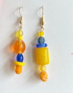 These new beach earrings are represented in two different ways. Each pair of earrings is different but should be worn together. A fun way of looking at jewelry and a fun way looking at life. #Beaddifferentinc Trendy Single Earring For Beach Jewelry, Trendy Single Earring For Beach, Single Earring For Everyday Summer Wear, Multicolor Fun Earrings For Vacation, Trendy Beach Earrings With Colorful Beads, Fun Multicolor Earrings For Vacation, Single Earring For Beach Summer, Beach Fun Drop Earrings Jewelry, Fun Dangle Earrings For Beach