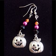 Halloween-Ready Handmade Earrings Feature Smiling Jack-O-Lantern Charms Paired With Black And Orange Crystal And Purple Glass Pearl Beads. Length From Tops Of Hooks 2.37". Pumpkin Charms Measure 16 X 15mm. Purple Earrings For Halloween Party, Novelty Purple Earrings For Party, Purple Novelty Earrings For Party, Purple Earrings As Halloween Gift, Handmade Purple Halloween Earrings, Purple Earrings For Halloween Gift, Gothic Earrings Diy, Beaded Pumpkin Earrings, Pumpkin Bead