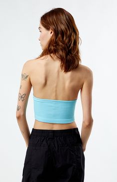 Introducing the Seamless Scoop Halter Top from Est. PAC 1980, crafted from seamless ribbed fabric for a sleek and comfortable fit. With its flattering scoop neckline, chic open-back design, and cropped fit, this top adds effortless style to any ensemble.


	Seamless ribbed fabric
	Good stretch
	Scoop neckline
	Fixed halter strap
	Open back design
	Cropped length
	Fitted
	94% polyamide, 6% elastane
	Hand wash
	Model is wearing a size small Seamless Light Blue Crop Top For Spring, Fitted Seamless Light Blue Crop Top, Light Blue Fitted Seamless Crop Top, Fitted Light Blue Seamless Crop Top, Blue Seamless Tank Top For Spring, Trendy Blue Seamless Top, Blue Fitted Seamless Tank Top, Fitted Blue Tank Top With Seamless Construction, Light Blue Seamless Tank Top For Spring