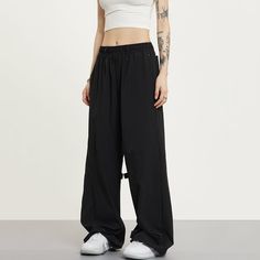 5ft 4''(166cm) tall, 95 lbs(43kg) weight and wearing a size S - BLACK- Wide baggy fit Black Full-length Bottoms For Streetwear, Black Wide-leg Parachute Pants For Streetwear, Oversized Urban Black Bottoms, Solid Color Wide Leg Sweatpants For Streetwear, Black Full Length Bottoms For Streetwear, Sporty Oversized Solid Color Pants, Sporty Oversized Pants, Solid Color High-waisted Pants For Streetwear, Black Parachute Pants For Streetwear