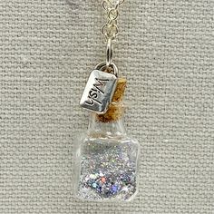 Wish Charm Silver Glitter In A Bottle Long Necklace Handmade Ooak Magic Fairy Dust Captured In A Miniature Glass Bottle With Cork Made Into A Pendant With A Little Silver Charm That Says Wish. This Silver Tone Necklace Is One Of A Kind, Handmade By Me. Measures 30 In Long. Comes In A Gift Box. Unique Gift, Boho, Festival, Kawaii, Disney, Magic, Cute, Fairy Kei, Twee, Pixie Dust, Cosplay, Costume Silver Glitter Necklace For Gift, White Glitter Jewelry Gift, White Glitter Jewelry As Gift, White Glitter Jewelry For Gifts, Long Necklace Handmade, Bronze Chain Necklace, Elephant Charm Necklace, Jar Jewelry, Brown Beaded Necklace