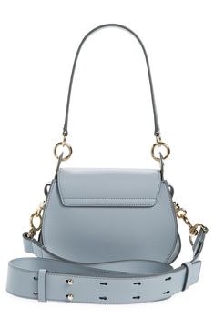 Gleaming pierced-ring hardware highlights the equestrian-inspired silhouette of this calfskin-leather saddle bag. Interchangeable straps for over-the-shoulder or crossbody carry add everyday convenience to the luxe style. Magnetic-snap flap closure Removable top handle; removable, adjustable shoulder/crossbody strap Linen lining Leather Made in Italy Designer Handbags This brand has B Corp certification, representing business practices with emphasis on social and environmental performance, accou Luxury Crossbody Shoulder Bag With Horsebit Detail, Everyday Satchel Shoulder Bag With Horsebit Detail, Modern Top Handle Shoulder Bag With Horsebit Detail, Modern Shoulder Bag With Horsebit Detail And Top Handle, Office Shoulder Bag With Horsebit Detail And Crossbody Shape, Office Crossbody Shoulder Bag With Horsebit Detail, Evening Crossbody Shoulder Bag With Horsebit Detail, Chic Shoulder Bag With Horsebit Detail And Top Handle, Everyday Crossbody Shoulder Bag With Horsebit Detail