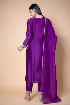 Purple chanderi silk kurta with embroidered floral motifs. Paired with embroidered pant with sequins work hem and tissue organza sheer dupatta.
Component: 3
Pattern: Embroidered
Type Of Work: Sequins, Floral
Neckline: Round
Sleeve Type: Full sleeves
Fabric: Chanderi silk, Tissue organza
Color: Purple
Other Details: 
Sequins embroidered cuffs and bodice
Floral embroidered dupatta
Occasion: Puja, Mehendi - Aza Fashions Kurta Set For Women, Embroidered Pants, Sequins Embroidery, Kurta Set, Full Sleeves, Embroidered Silk, Set For Women, Aza Fashion, Full Sleeve