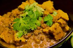 a bowl filled with food and garnished with cilantro