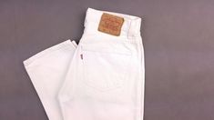 Sale! Free shipping for two or more items. Add to cart and check. Vintage Levi's 501 jeans 1990s, white Color. Made in USA 1993, factory 522. FABRIC: 100% cotton denim, miniature spots difficult to see. SIZE on tag: W31 L32 -> actual W29 L30,5 Please refer to measurements: Waist: 29 inch / 73 cm  Hips: 38 inch / 97 cm Thigh: 21 inch / 54 cm Inner length: 30,5 inch / 78 cm Outer length: 41 inch / 105 cm Leg opening: 13,5 inch / 35 cm Rise front: 11 inch / 27,5 cm Rise back: 14,5 inch / 36,5 cm Fe Levis 501 Women, Levi 501 Jeans, White Levis, Vintage 501, Streetwear Jackets, Levis Vintage, Vintage Clothing Stores, Vintage Sportswear, Vintage Trousers