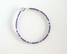 Purple bracelet, purple and silver beaded bracelet, seed bead bracelet, dainty purple bracelet, anklet, ankle bracelet, violet, one strand❤ SIZESThis item comes in several sizes. Kindly choose at checkout. The standard size for an average woman is 7”. For a child, a 6” would be appropriate. I recommend you measure your wrist to determine the best fit.❤ PROCESSING AND SHIPPINGMost orders are made and shipped out in one business day. Please check delivery timeframes for your location on the descri Small Beaded Bracelets Purple, Purple Beaded Anklets, Dainty Purple Beaded Bracelets With Round Beads, Dainty Purple Beaded Bracelet With Round Beads, Dainty Purple Beaded Bracelet, Summer Jewelry Diy, Bracelet Violet, Purple Beaded Necklace, Beaded Diy