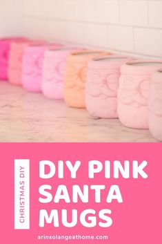 pink and white jars with the words diy pink santa mugs