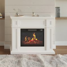 a fire place in the middle of a room with a white rug on the floor