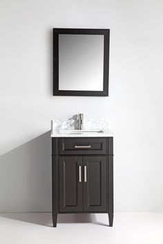 a bathroom vanity with a mirror above it and a sink under the cabinet in front