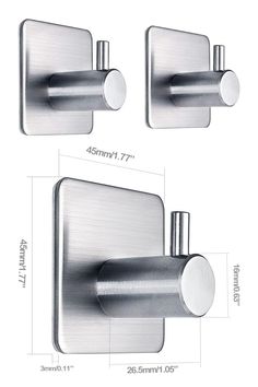 two stainless steel wall mounted toilet paper dispensers with the measurements for each one