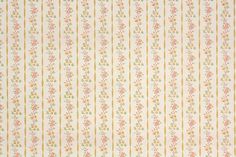 an old fashioned wallpaper with flowers and stripes in yellow, pink, orange and white