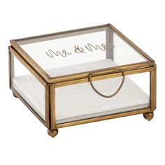 a glass and gold box with the word love on it