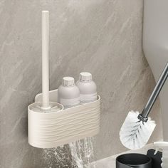 a bathroom sink with soap dispenser, toothbrush holder and cup on it