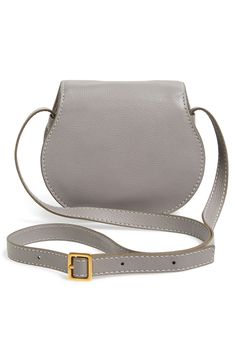 Curvaceous detailing ornaments the saddle-shaped flap of a luscious crossbody crafted from sumptuous grained leather. Style Name:Chloé Mini Marcie Leather Bag. Style Number: 903258. Luxury Crossbody Saddle Bag With Removable Pouch, Luxury Saddle Bag With Removable Pouch Crossbody, Elegant Crossbody Saddle Bag With Leather Lining, Luxury Saddle Bag With Magnetic Closure In Satchel Shape, Evening Textured Leather Crossbody Saddle Bag, Chic Saddle Flap Bag, Chic Crossbody Saddle Bag With Magnetic Closure, Luxury Leather-lined Crossbody Saddle Bag, Elegant Saddle Flap Bag With Adjustable Strap