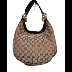 Brown And Tan Gucci Hobo Handbag With A Black Strap And Gold And Silver Hardware. Bag Is In Excellent Condition, No Tears Or Rips On The Outside Or The Inside. Bag Is Very Clean Inside And Out No Stains. Hobo Handbag, Inside Bag, Hobo Handbags, Silver Hardware, Gold And Silver, Bag Lady, Gucci, Handbags, Silver