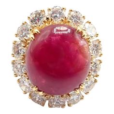 Van Cleef & Arpels 18k Yellow Gold Large Cabochon Ruby Diamond Ring   The Van Cleef & Arpels Fleurette ring is a stunning piece of jewelry crafted from 18k yellow gold and adorned with rubies and diamonds. The ring features a double flower design, with each flower consisting of six petals made from round cut rubies and diamonds. The petals are arranged in a floral shape, creating a beautiful contrast against the gold band. The ring is a perfect accessory for any occasion, adding a touch of elega Rubies And Diamonds, Cabochon Ruby, Van Cleef And Arpels Jewelry, Van Cleef & Arpels, Ruby Diamond Ring, Precious Rings, Van Cleef And Arpels, Ruby Diamond Rings, Unusual Jewelry