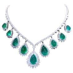 A master piece , absolutely stunning design, a very piece of art by Italian jewelry designer. Necklace come in 18K gold with 9 pieces of Natural Zambian Emeralds, extra fine quality, CEO minor , spectacular color , in perfect pear cabochon cut , of 59,00 carats, and 283 pieces of Natural Diamonds of 14,00 carats, F color VS clarity , very sparkly, top quality. Handcrafted by artisan goldsmith. Excellent manufacture and quality of stones. Complete with AIG report. Whosale price . Note: on my shipment, no taxes. Italian Jewelry Designers, Sparkly Top, 18k Gold Necklace, Master Piece, Sparkly Jewelry, Designer Necklace, Zambian Emerald, Italian Jewelry, Emerald Jewelry