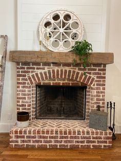 a brick fireplace with a potted plant on top