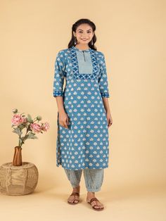 Blue dabu flower printed straight kurta, has a mandarin collar, mirror and katha embroidered yoke, three-quarter sleeves and stripes Print afgani Pants has Elasticated Waistband Fabric: 100% Cotton Color: Blue Note: Available in other colors Wash Care Instruction - Dry Clean Only The product will be shipped within 15-20 days of order placed Size Chart: Kurta Size XS S M L XL XXL XXXL Bust 36 38 40 42 44 46 Waist 32 34 36 38 40 42 Hip 38 40 42 44 46 48 Shoulder 14 14.5 15 15.5 16 16.5 Armhole 18 Casual Long Sleeve Cotton Salwar Kameez, Spring Straight Kurta With Printed Border, Spring Block Print Straight Kurta Set, Cotton Bandhani Print Sets For Spring, Traditional Block Print Sets For Spring, Spring Cotton Sets With 3/4 Sleeve, Cotton Salwar Kameez With Printed Border For Spring, Traditional Spring Kurta With Printed Motifs, Traditional Kurta With Printed Motifs For Spring