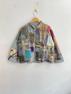 a colorful jacket hanging on a wall