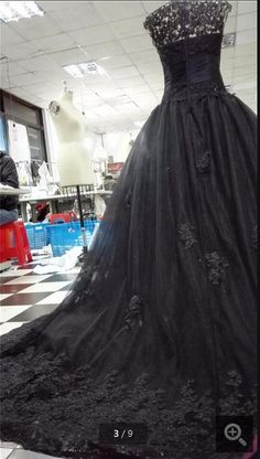 a black dress on display in a store