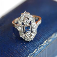 This stunner is a must see!  This ring is currently a size 6, and available in our Vintage showcase at our Glebe location.  Materials 14kt and Platinum 18 x 0.02ct = 0.36ct Single Cut VS-SI GHI 2x 0.05ct=0.10ct Full Cut 2 x.025ct =.05ct Full Cut VS-SI GHI VG 3mm =.10ct Natural Blue Sapphire Blue Sapphire Ring, Art Deco Diamond, Blue Sapphire Rings, Natural Blue Sapphire, Magpie, Art Deco Style, Deco Style, Art Deco Fashion, Custom Jewelry