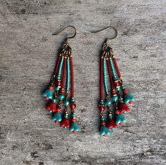 Beautiful and original red and pale blue tones, bronze bohemian Czech glass leaf earrings.  Spiritual Jewelry designed and carefully handmade by Rushweaver Jewellery in an ancient earthy tribal style.  These boho beauties dangle 78mm from the top of nickel free brass ear wires. For all free spirited women who want to enjoy their unique style! Handmade Tassel Earrings For Festivals, Handmade Unique Tassel Earrings For Festivals, Bohemian Chandelier Earrings With Ear Wire For Festivals, Adjustable Bohemian Flower Earrings, Adjustable Bohemian Drop Flower Earrings, Bohemian Beaded Drop Earrings With Ear Wire, Bohemian Dangle Flower Earrings For Pierced Ears, Handmade Bohemian Tassel Earrings For Festivals, Bohemian Chandelier Earrings For Pierced Ears